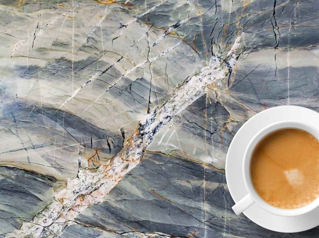 IRG's Ijen Blue Quartzite countertop with coffee cup.