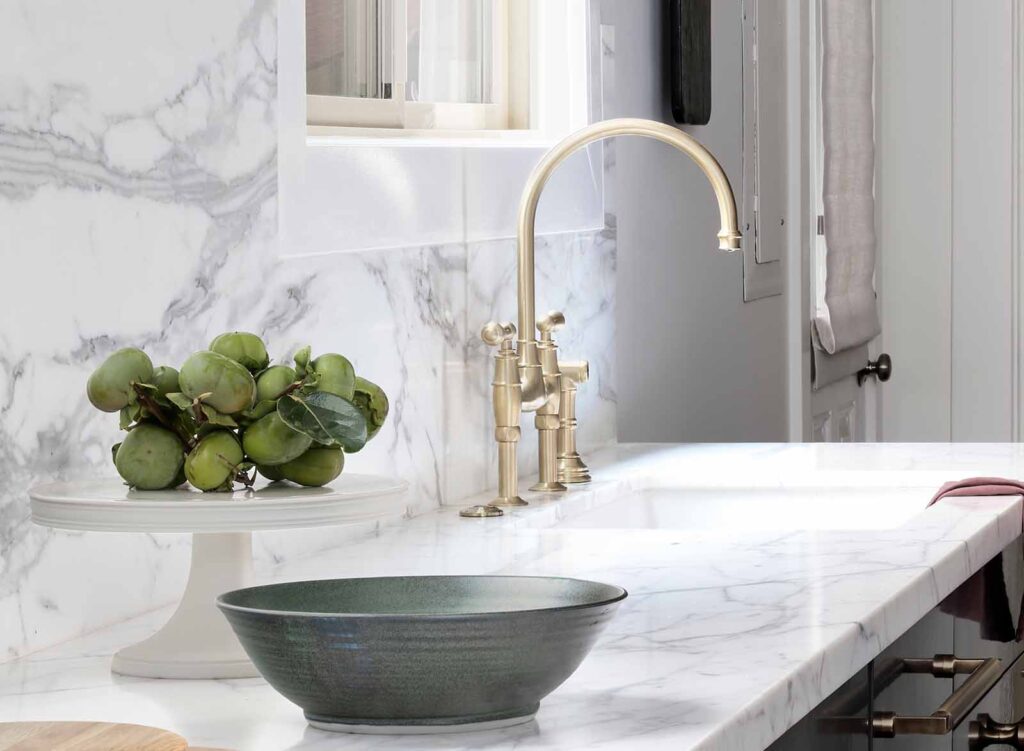 IRG's Calacatta Medici Marble appears elegantly on kitchen counter and backsplash