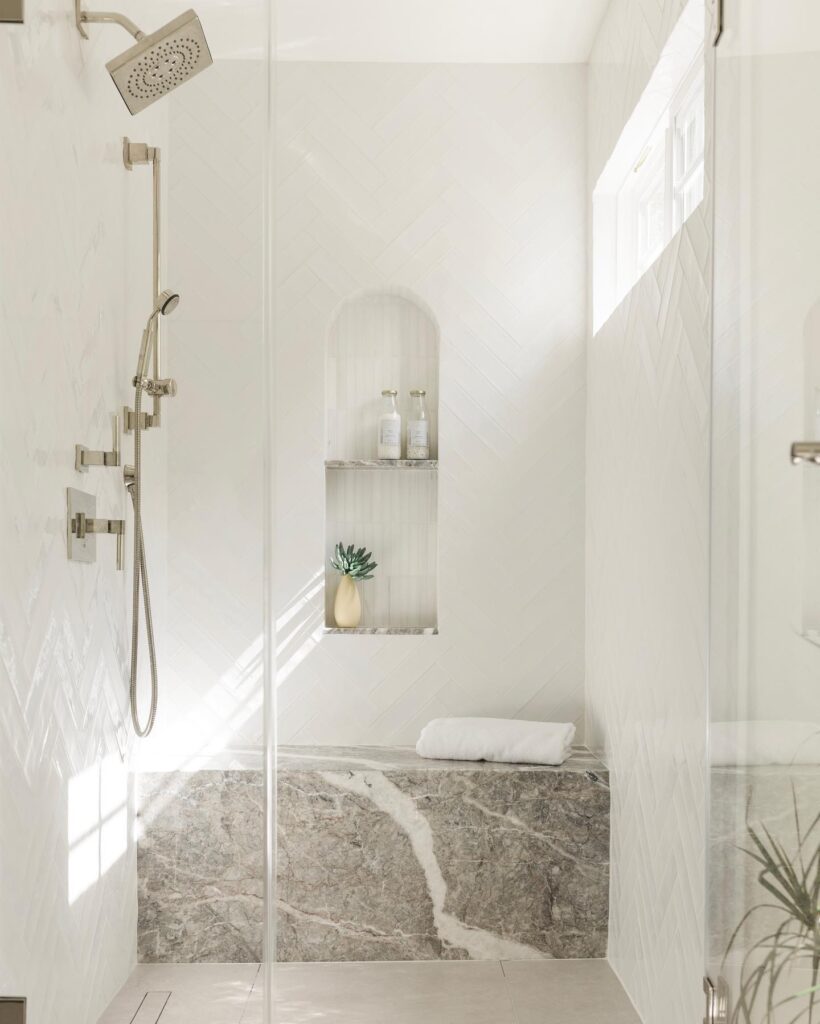 A renovated shower to love. Lightened and brightened with AKDO tiles, IRG’s Fior De Pesco Marble, and updated fixtures for a luxuriously inviting space.