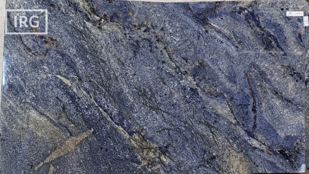 Azul Bahia granite slab from IRG in the Sacramento showroom, featuring deep blue tones with white, black, and brown accents, perfect for luxury kitchen countertops