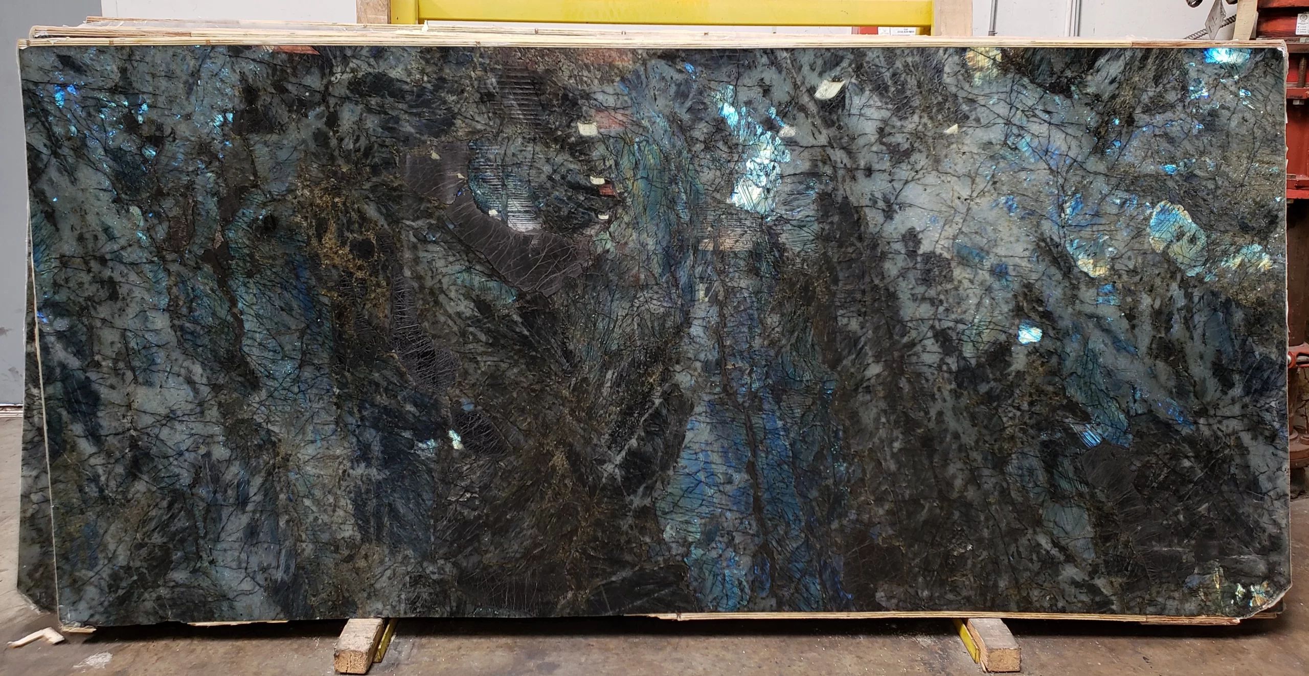 Lemurian Blue Supreme granite slab with shimmering labradorite crystals, perfect for Bay Area bar tops and Sacramento accent walls.