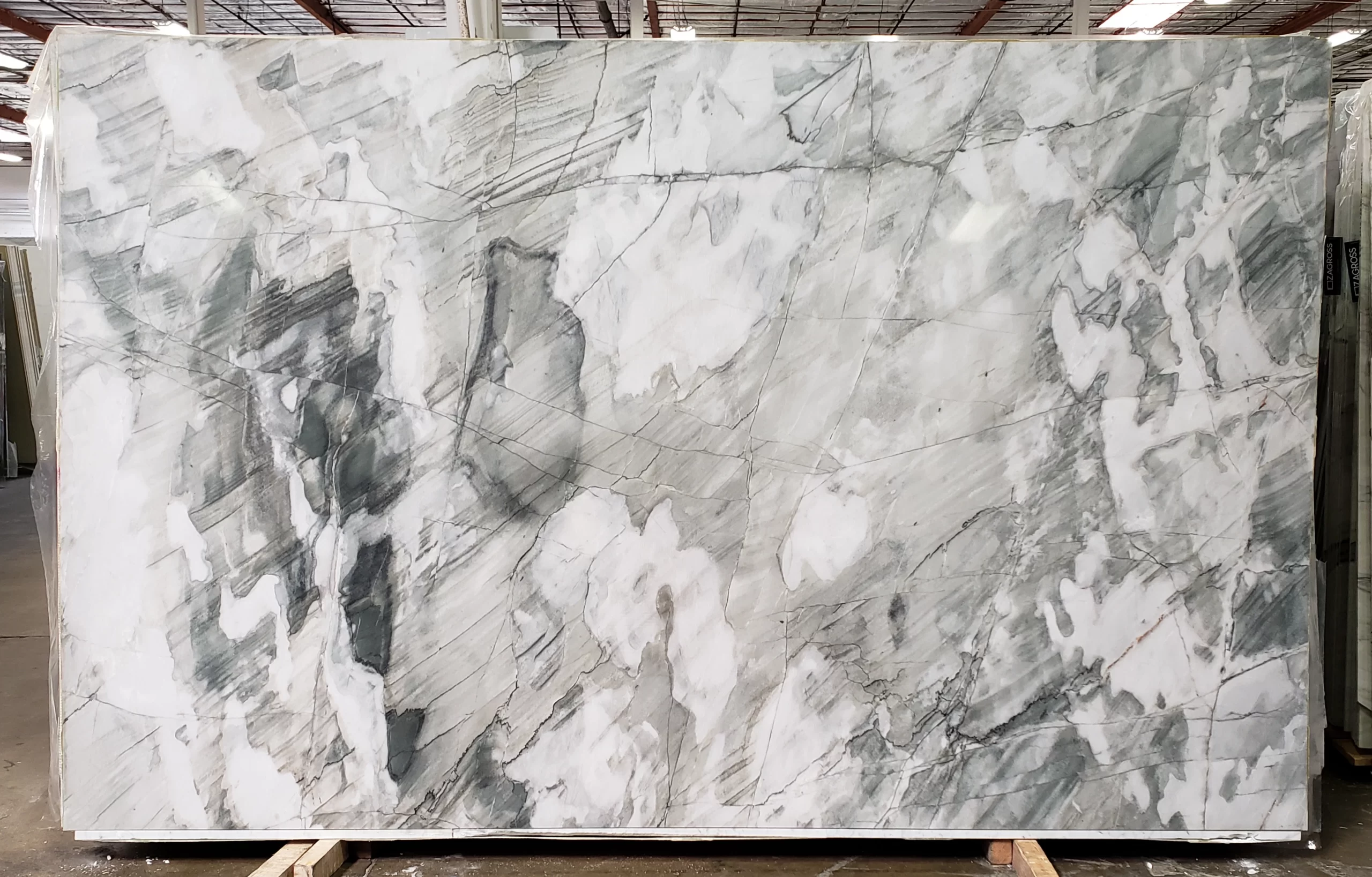 Acqua Bello polished quartzite slab with flowing green, gray, and white patterns, perfect for Bay Area kitchens or Sacramento bathroom designs.